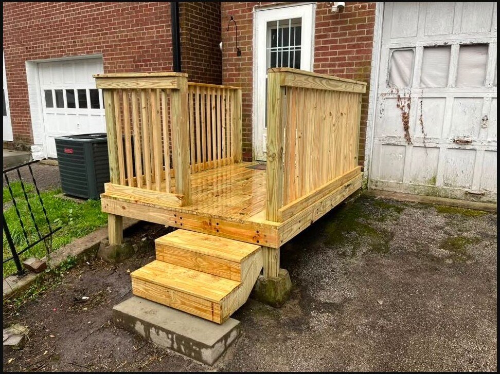 New pressure-treated wood steps, landing, and safety railing