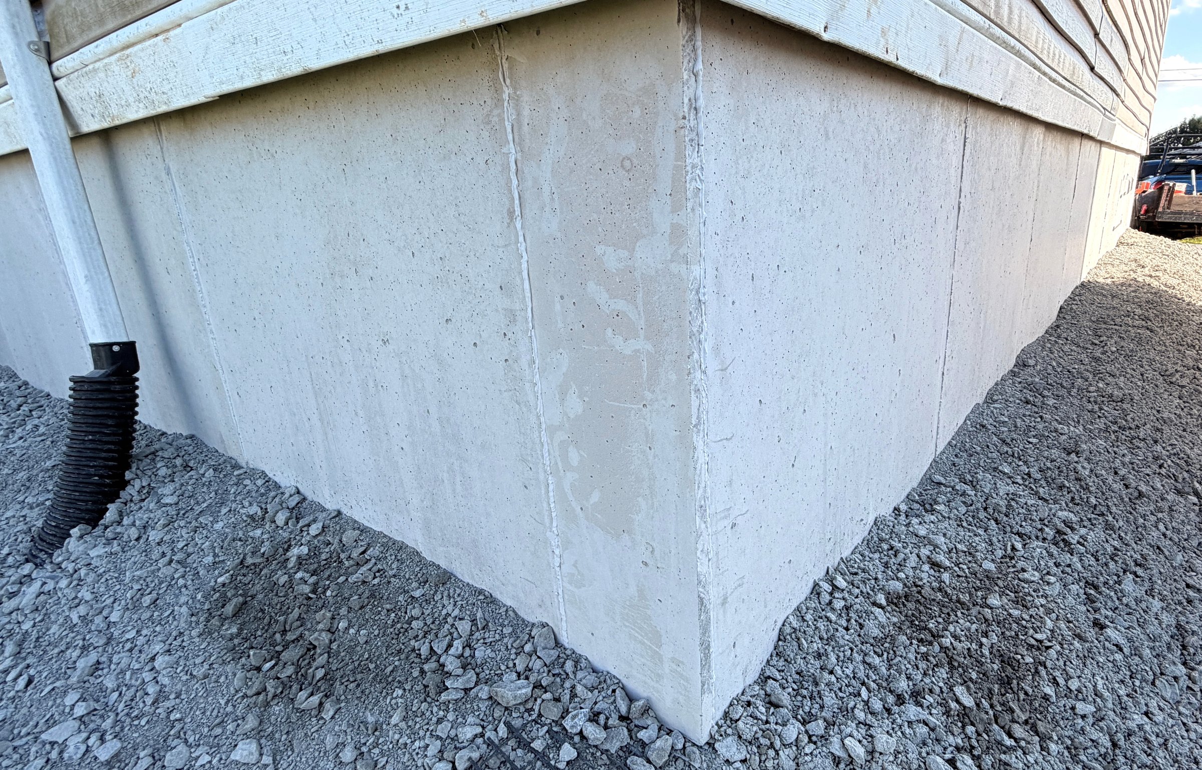 Close finished view of DuraSkirt concrete panels meeting at an exterior corner