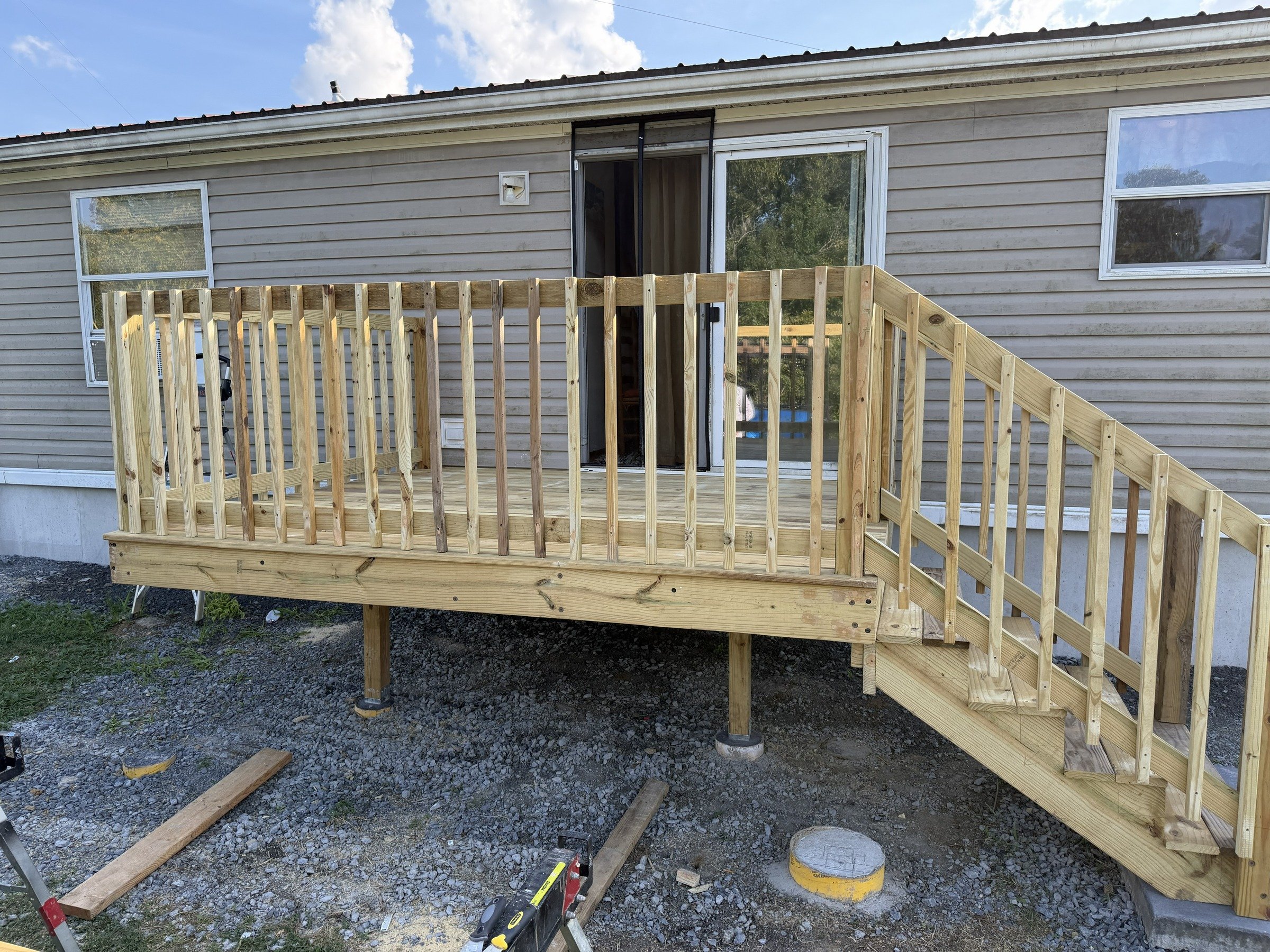 Front view of entry-deck stairs and balusters without the top handrail